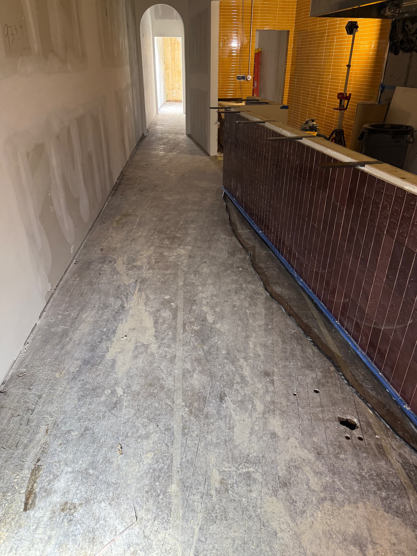 1932 Commercial Space, Vinyl Tile and Adhesive Off before restoration