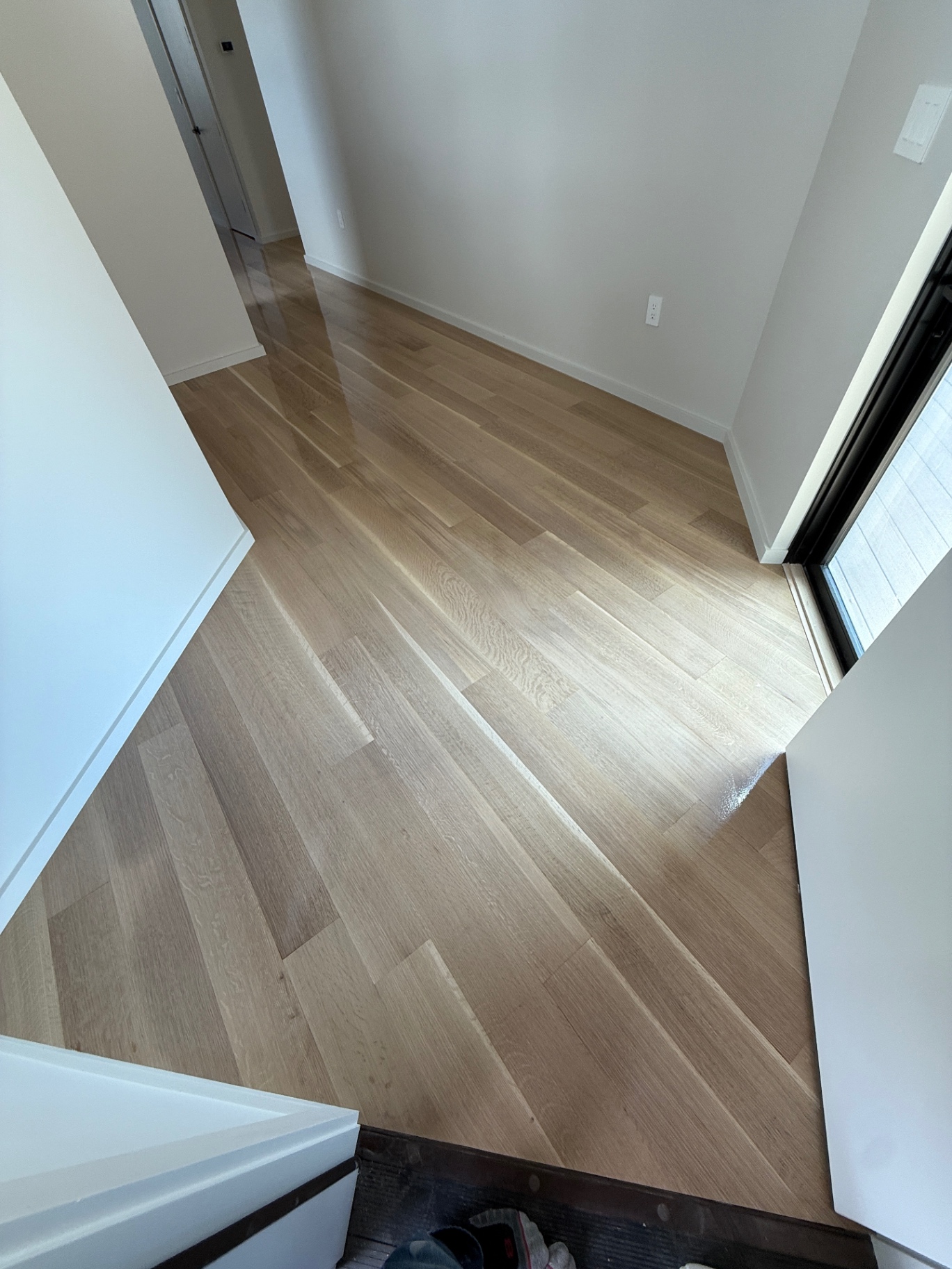 Wide plank white oak floor with a natural matte finish in a modern interior